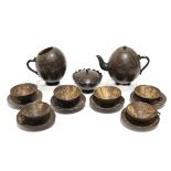 A 1920’s Sri Lankan carved coconut shell fifteen piece tea service (settings for six), part w.a.f.