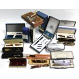 A collection of pen sets, all cased. *PLEASE NOTE* The gold pen in 1st image directly below the tan