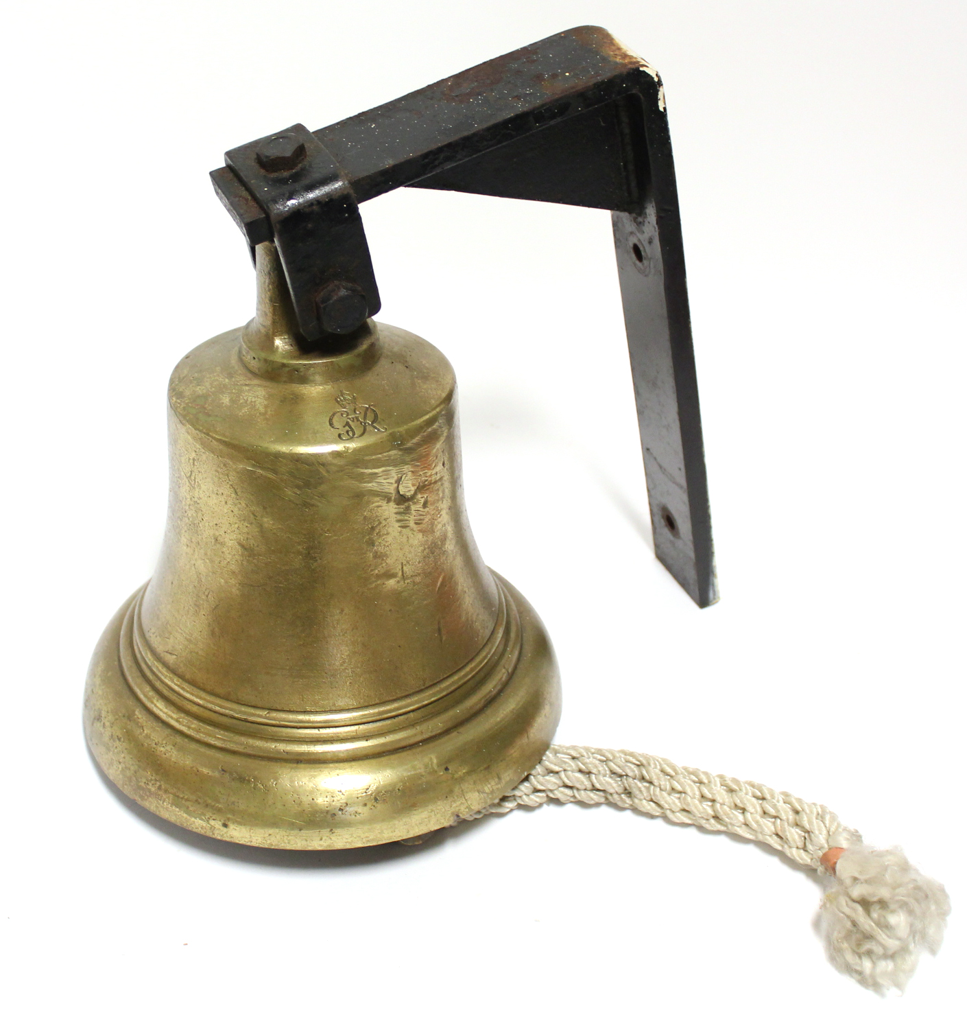 A MID-20TH CENTURY BRASS BELL STAMPED “GR VI”, 9½” diam. x 11” high, with cast iron wall bracket.