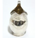 A George III upright ovoid milk jug with engraved decorative bands, reeded rim, & loop handle, 4¼”