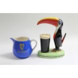 A Carlton ware toucan Guinness table lamp base, w.a.f.; & a Carlton ware “Guinness” water jug.