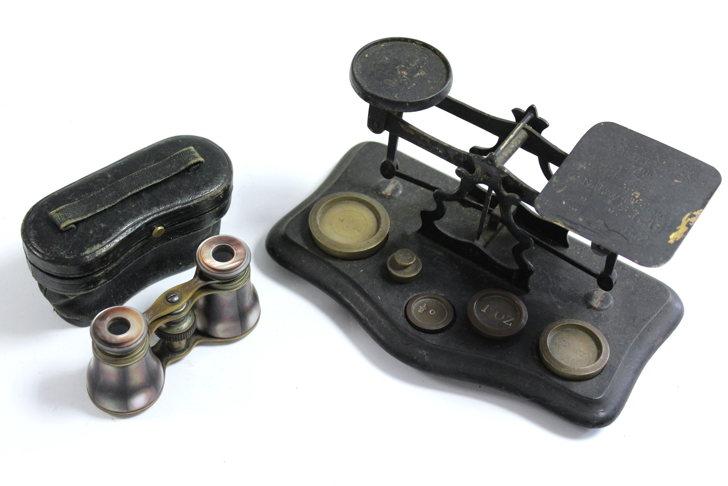 A brass letter scale with five brass weights & mounted on ebonised serpentine front plinth base; & a