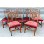 A set of six Georgian oak dining chairs with pierced & shaped splat backs, padded seats & on