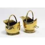 Two brass helmet-shaped coal scuttles, 12” & 10” high.