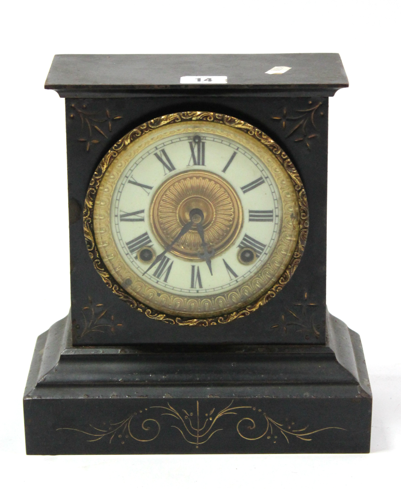 A Victorian mantel clock with black roman numerals to the white enamel dial, with striking