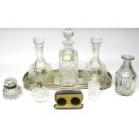 Four glass decanters, three with silver labels; three glass receptacles; a silver plated rectangular