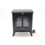 A Dimplex coal-effect electric fire in black-finish metal case, 21¼” wide, w.o.