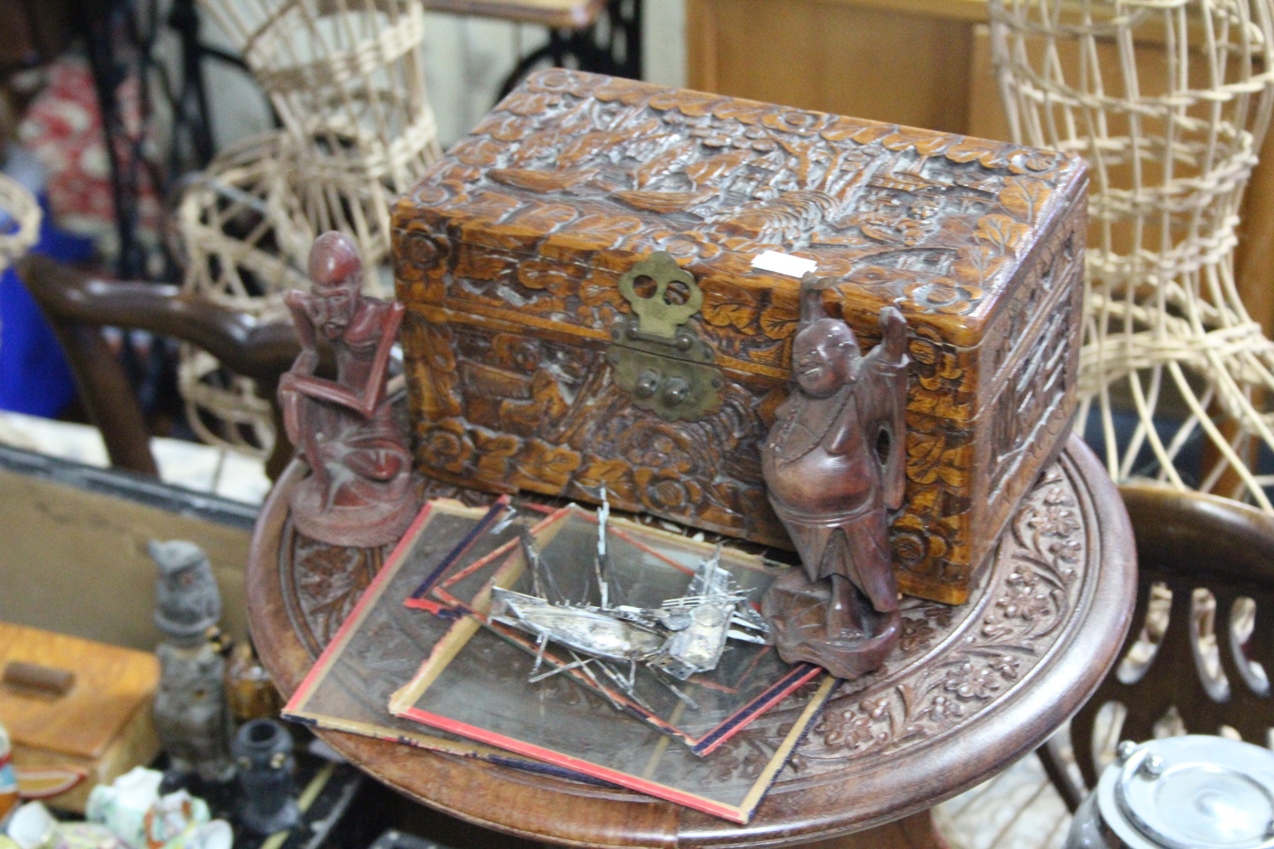 A 400-day mantel clock under glass domed dust shade; a carved wooden trinket box; a small carved