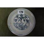 A Chinese blue & white floral decorated saucer dish, 4¾” diam.