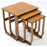 A Parker Knoll teak nest of three rectangular occasional tables.