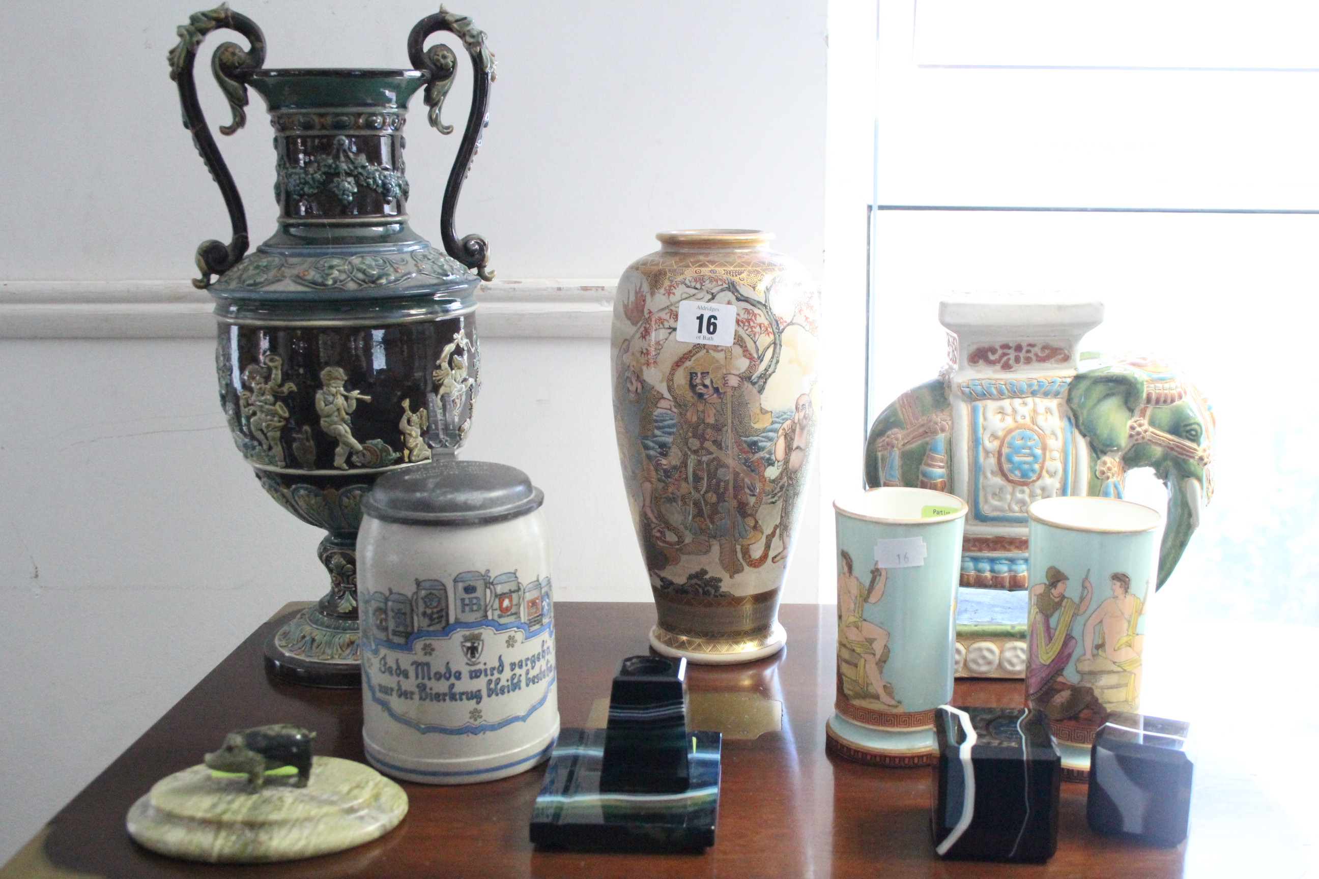 A Satsuma pottery vase with figure scene decoration; two ceramic biscuit barrels; & various other