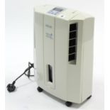 A Delonghi dehumidifier; & a Logik desk fan, both w.o.