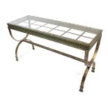 An iron-frame conservatory table inset glass plate to the rectangular top, & on shaped end