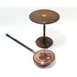 A 19th century copper warming pan with long turned wooden handle; & an inlaid mahogany circular