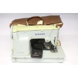 A Singer electric sewing machine, with case, w.o.