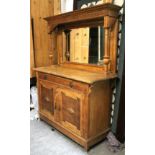 An Edwardian oak mirror-back sideboard, the upper part with blind fret-work frieze & inset