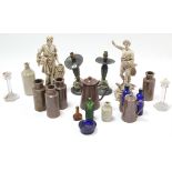 A pair of pewter candlesticks (converted to table lamps); a pair of pottery figures; various bottles