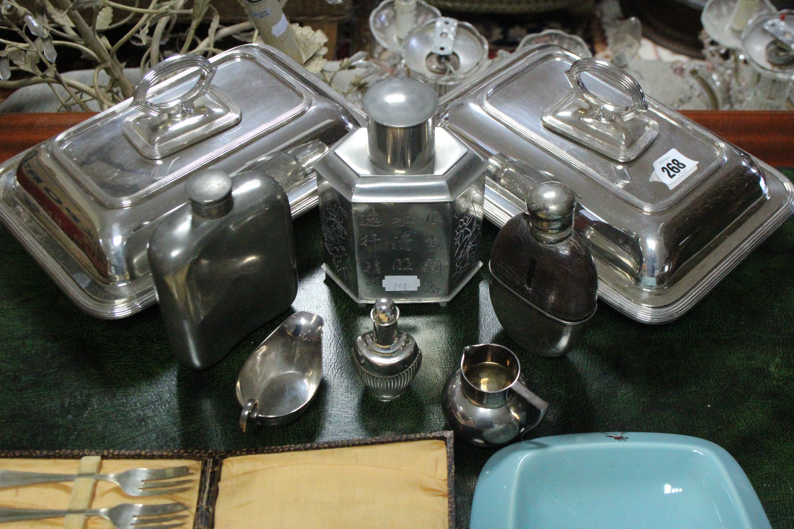 A pair of silver plated rectangular entrée dishes; two hipflasks; various items of cutlery, etc.