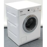 A Miele “Prestige Plus” washing machine in white-finish case, w.o.