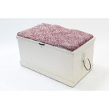 An early 20th century white painted deal blanket box with hinged lift-lid, rope side handles, & on