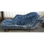 A Victorian chaise longue, upholstered buttoned blue velour, & on short turned legs with steel