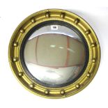 A regency-style gilt frame convex wall mirror with sphere border, 16¼” diameter.