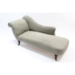 A Victorian chaise longue with scroll end, upholstered light grey material & on short turned legs