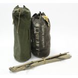 Two army kit bags; & a pair of skis & ski poles.