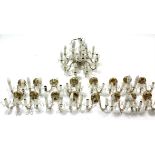 A set of four glass ten-branch chandeliers with scroll arms & hung with strands of beads & prism
