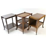 An oak rectangular three-tier tea trolley, on square supports, 22¾” wide; together with two other