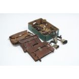 Three brass cowbells; various leather horse straps; & three leather briefcases.