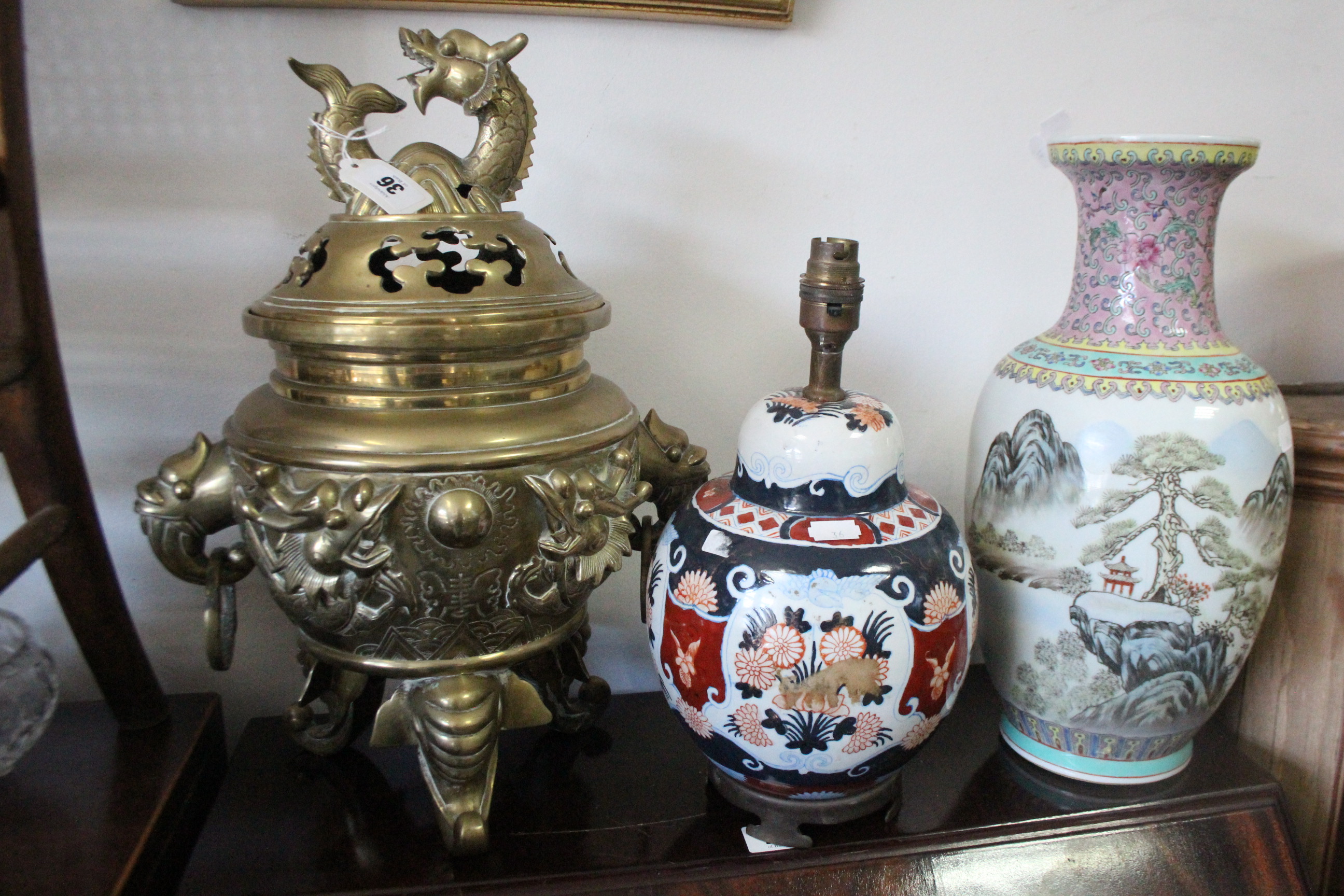 A Chinese large brass censer with dragon finial & on three elephant-head feet, 17” high; four gilt