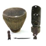 An African animal-hide covered drum, 15 ½” high; & four African carved treen ornaments.