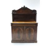 A Victorian mahogany chiffonier with low-stage panel back, the base fitted cushion-fronted frieze