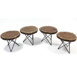 A set of four rustic style treen occasional tables each on three wrought-iron legs, 15” wide & a