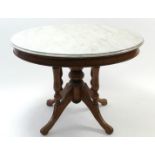 A 19th century-style mahogany dining table with white circular marble top, & on turned centre column