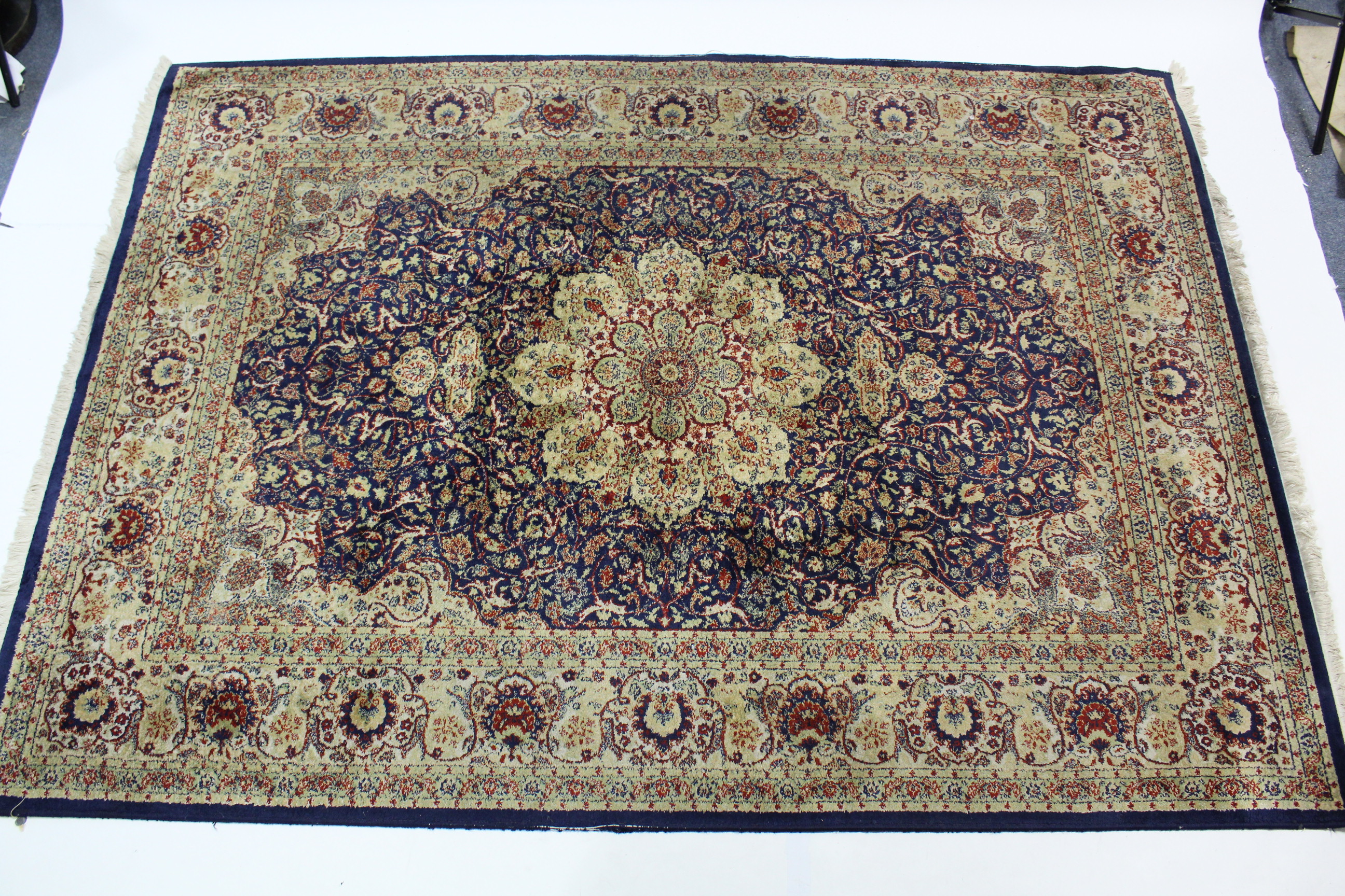 A modern Persian pattern large rug of blue & cream ground & with all-over multi coloured geometric