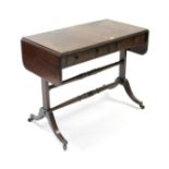 A mahogany sofa table fitted two frieze drawers, & on square end supports & splay legs joined by