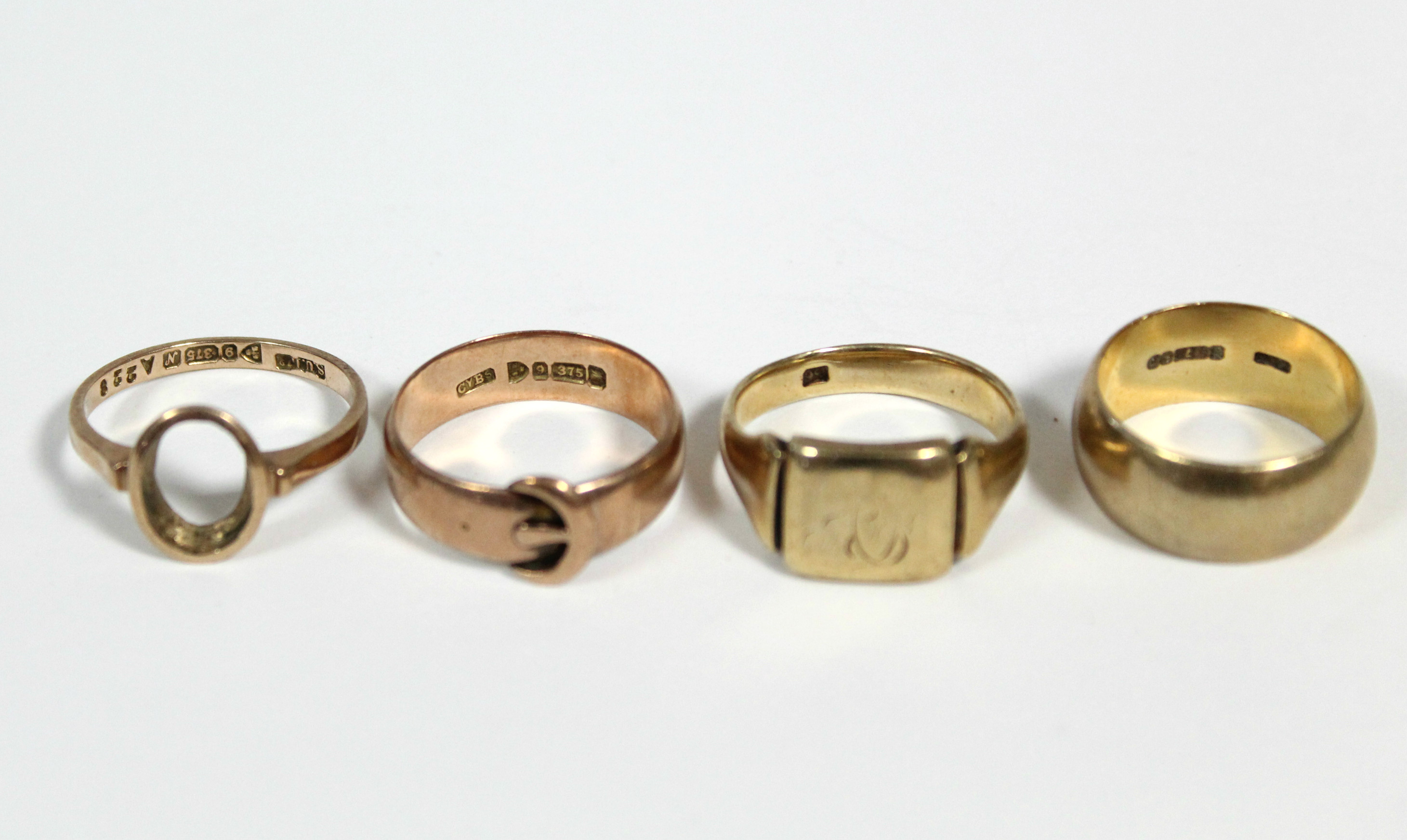 A 9ct. gold wedding band; a ditto signet ring; a ditto belt buckle ring; & a ditto dress ring – - Image 2 of 2