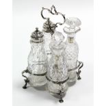 An early Victorian cruet stand with centre ring handle & on four pad feet, high, fitted four cut