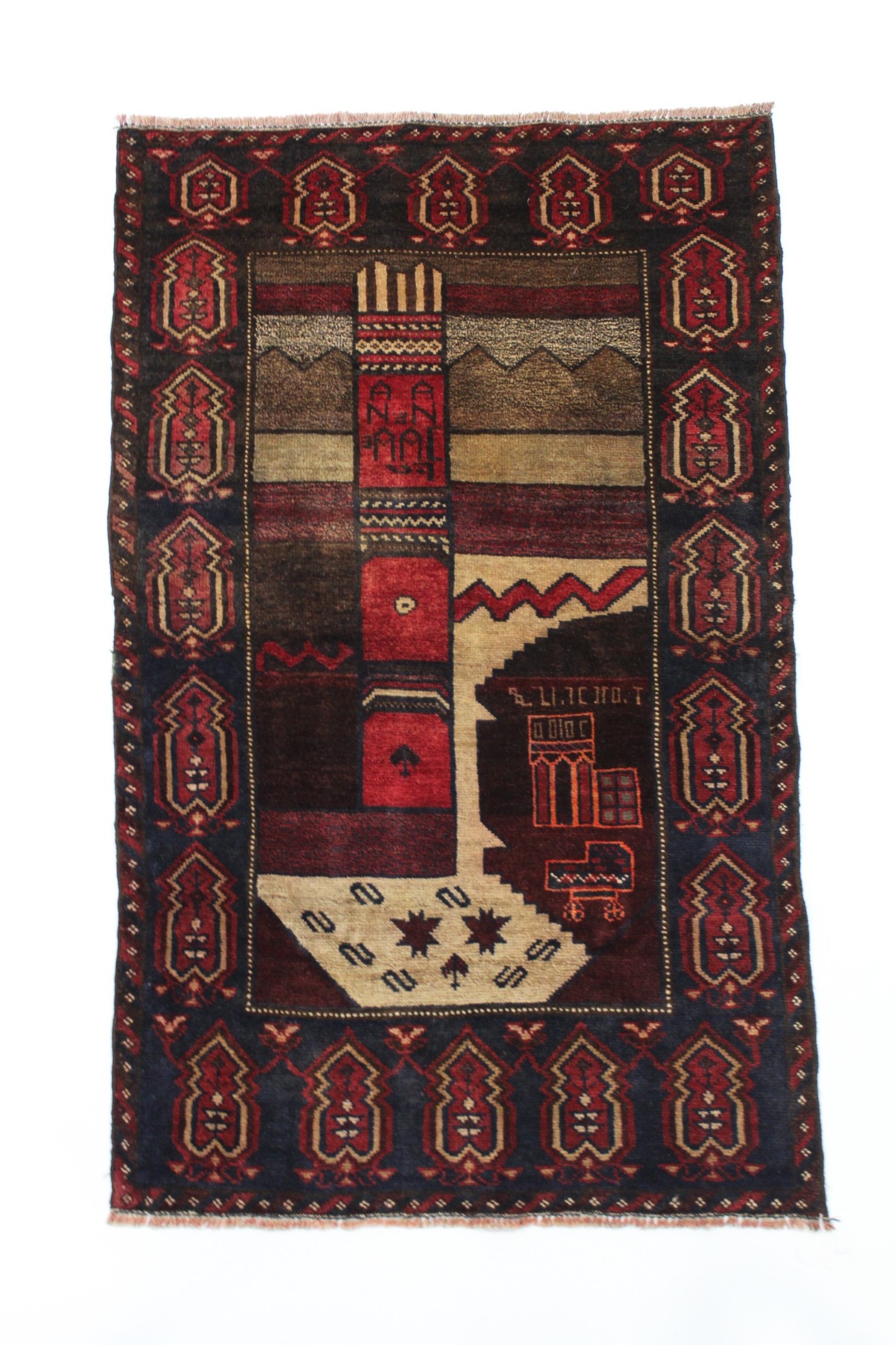 A Baluchi rug of crimson, ivory, & aubergine ground with central landscape design within a wide