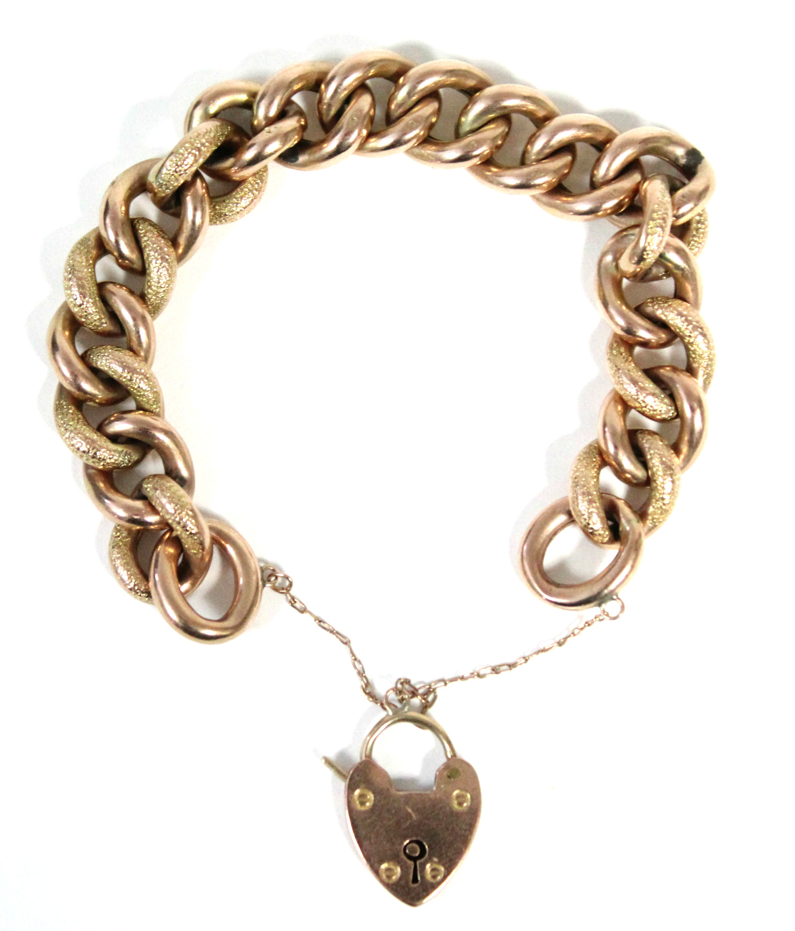 A 9ct. gold bracelet of large hollow textured curb links, with padlock clasp & safety chain. (30.