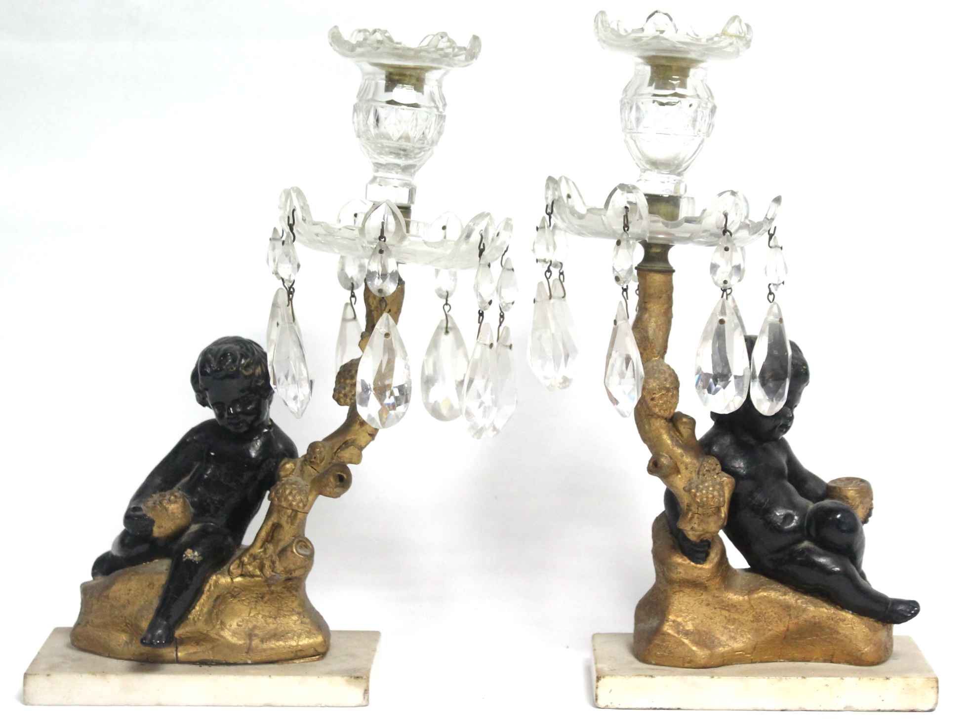 A pair of 19th century bronzed & gilt composition, & cut glass candle stands with putto & oak-branch