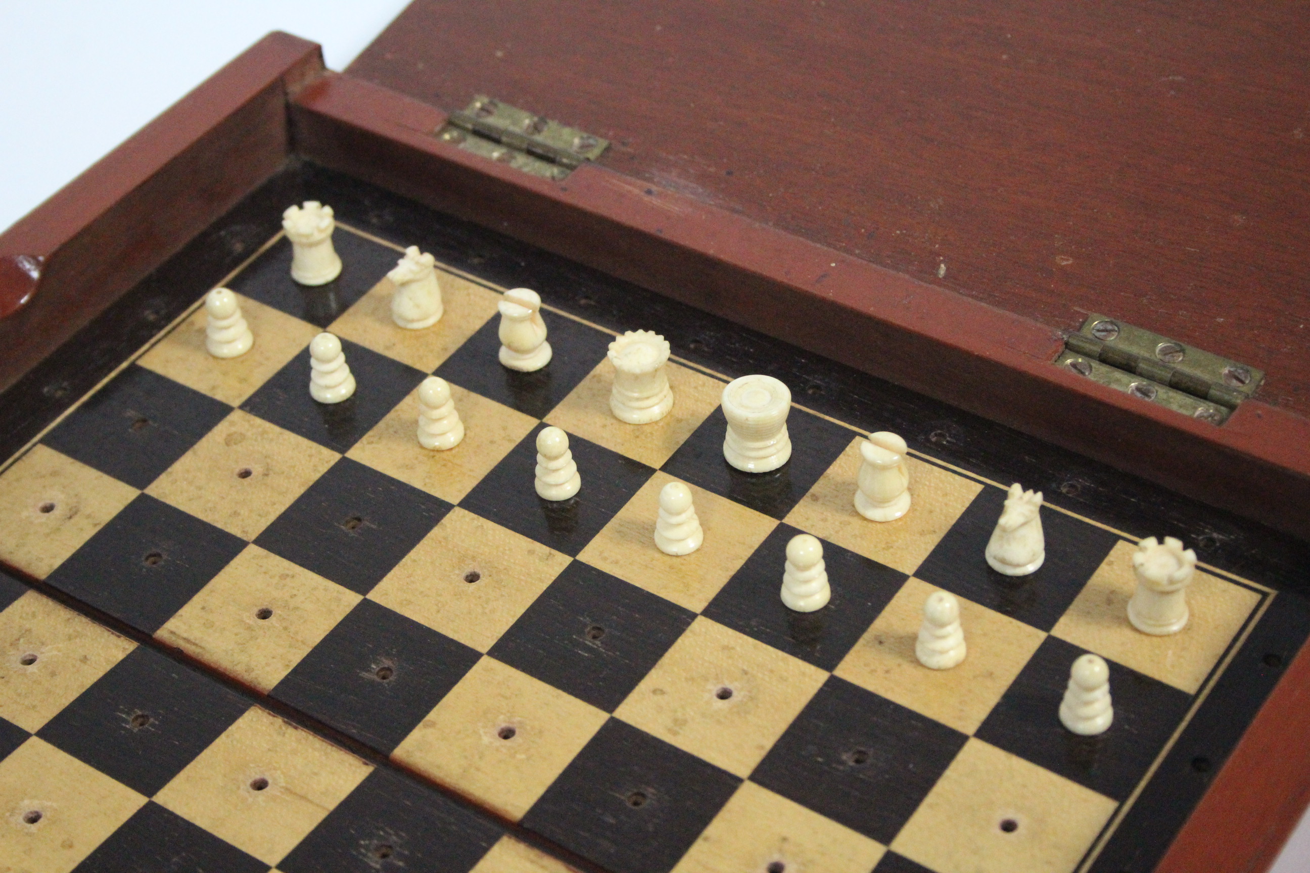 A late 19th century travelling ivory chess set of natural & red stain, height of Kings ½”, in - Image 2 of 5