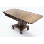 A regency rosewood sofa table with burr-yew & rosewood crossbanding, fitted two frieze drawers, on