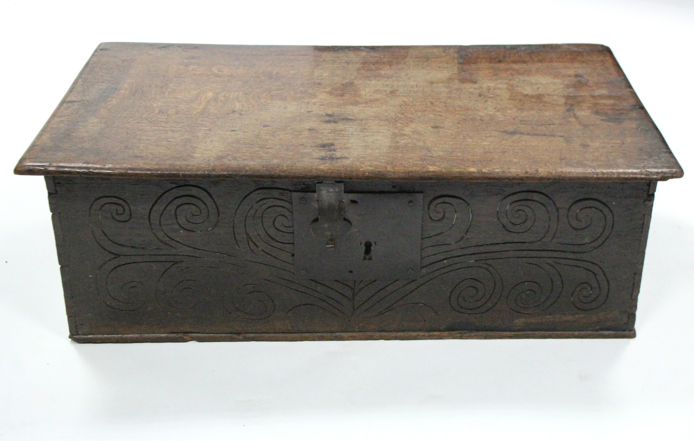 A late 17th century oak Bible box with hinged lid & naïve carved scroll decoration to the front; 26” - Image 3 of 4