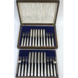 A set of twelve pairs of George V silver cake knives & forks with mother-of-pearl handles; Sheffield