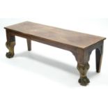 A 19th century mahogany long rectangular stool with gold-painted claw-&-ball feet; 54” wide x 18”