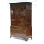 A GEORGE III INLAID MAHOGANY SECRETAIRE LINEN PRESS in the manner of Gillows of Lancaster, with