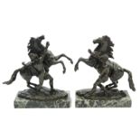 COUSTOU, Guillaume (after). A pair of 19th century bronze Marley horses on rectangular marble bases;
